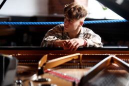 Ellis Arey: “Working Class-ical Hero”